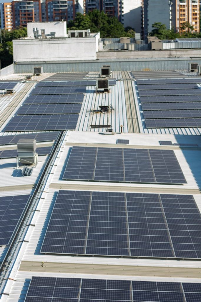 The Art of Drawing Readers In: Your attractive post title goes here Aerial view of solar panels on an urban rooftop in Valle del Cauca, Colombia.